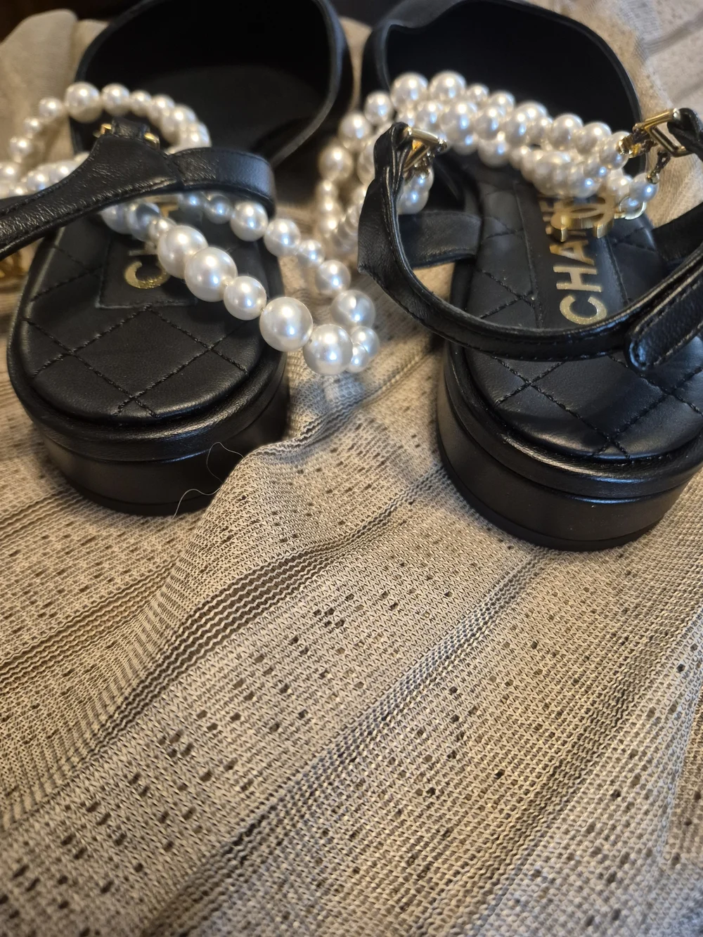 CHANEL black leather pointed-toe flats with pearls